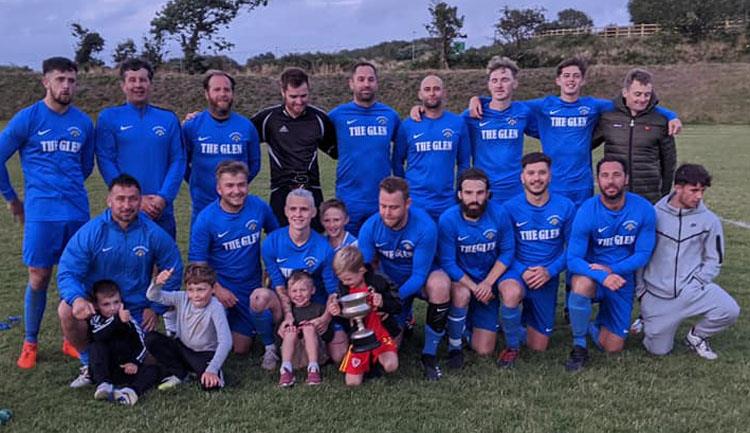 Merlins Bridge celebrate winning Eddie Merry Cup final