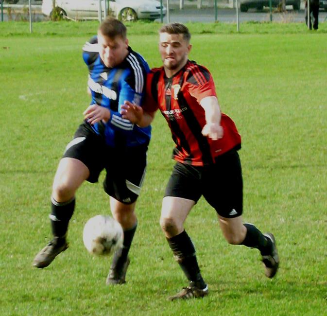 Gareth Fawcett and Wayne OSullivan battle for possession