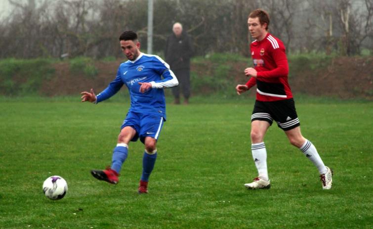 Midfielder Gethin Roberts plays the ball down the channel for the Bridge