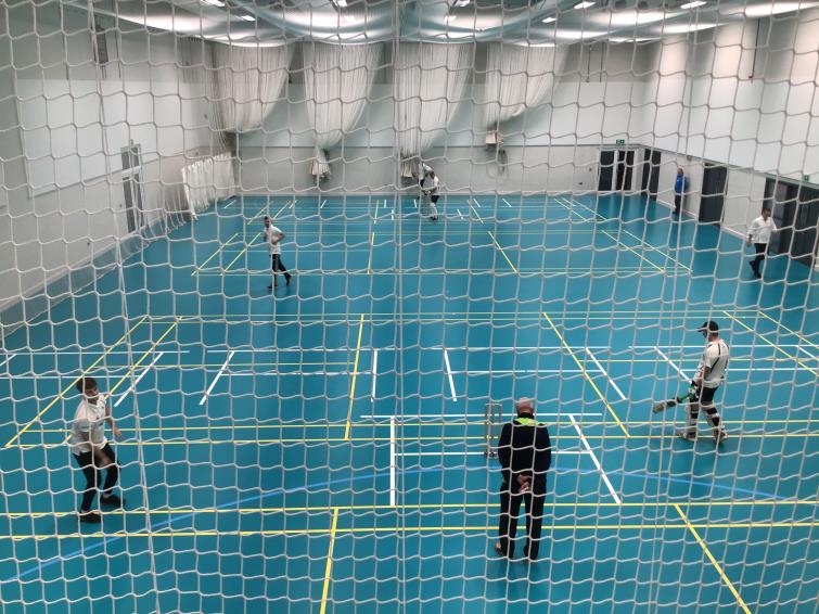 Indoor cricket action