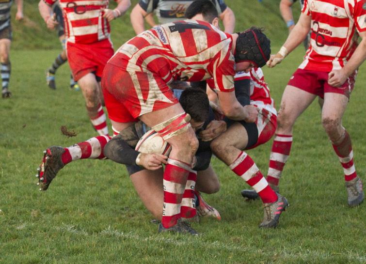 Ollie Reyland is tackled. Picture by ElwaSaints spread ball wide. Picture by Elwyn Davies