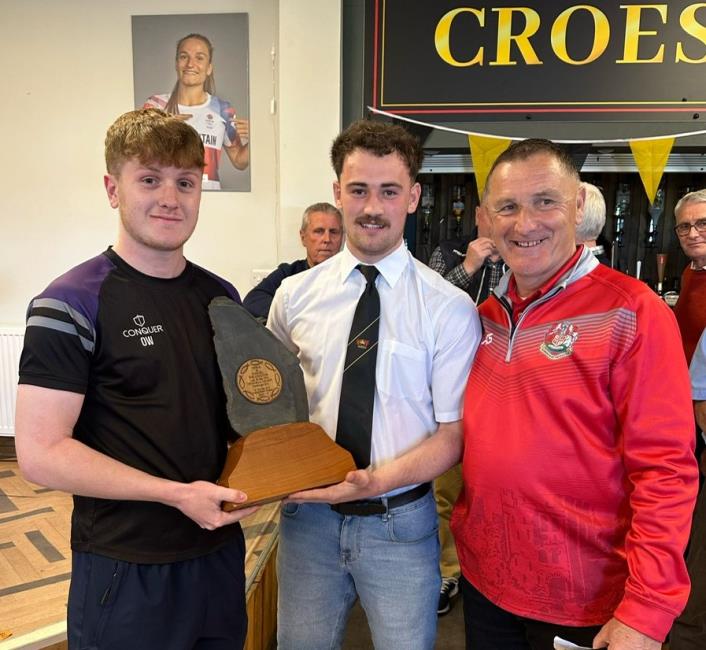 Saints skipper Nathan Foster receives the Willington slate from family members