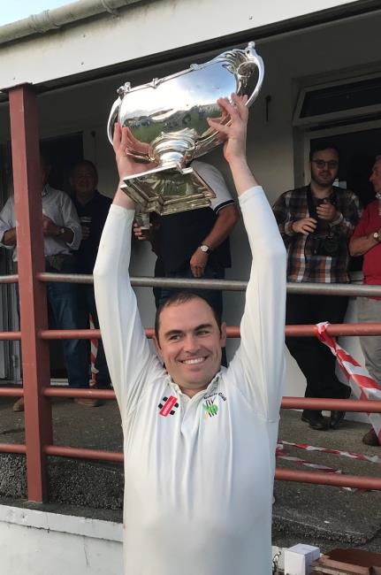 Sean Hannon holds the Bowl aloft