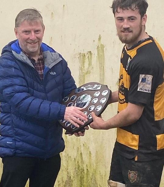  St Davids skipper Nathen Foster receiving the John Preece Cup from Richard Preece 