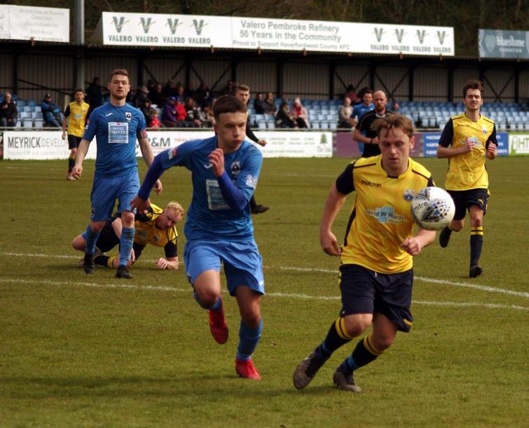 Ben Fawcett working hard to try and retain possession