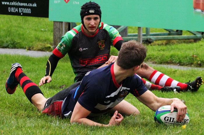 Tenby captain Johnny Morgan dives over for a try