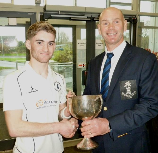 Kieran O Connor receives the silverware from Paul Webb