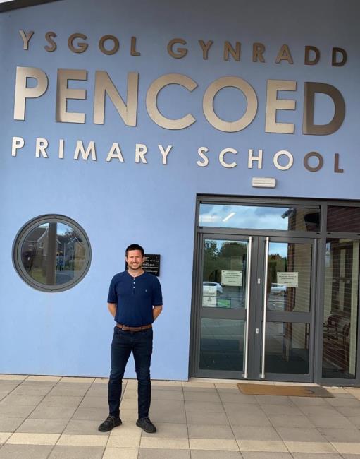 Adam Raymond at his school