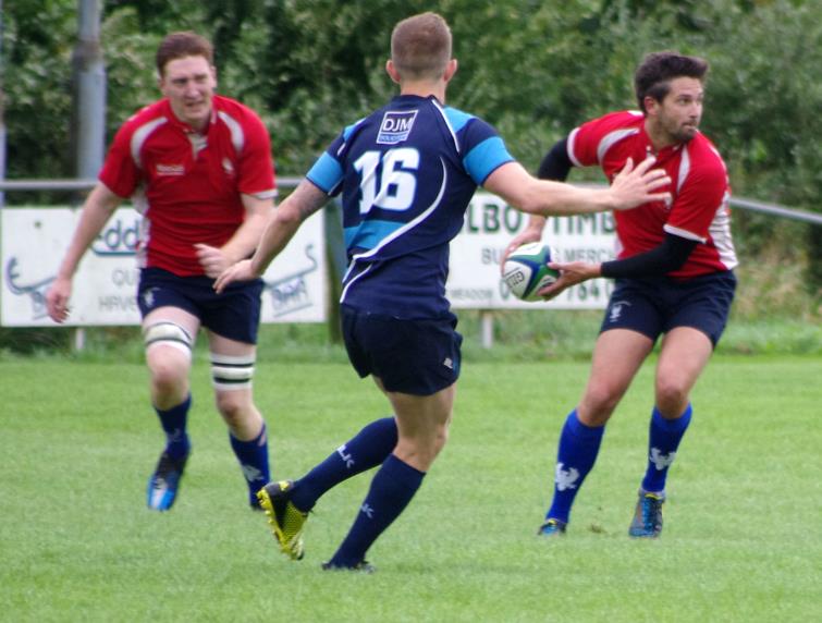 Haverfordwest outside half Mikey Jones releases his backs