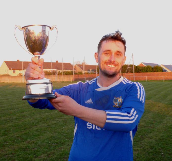 Swifts skipper Joe Boswell raises the cup aloft