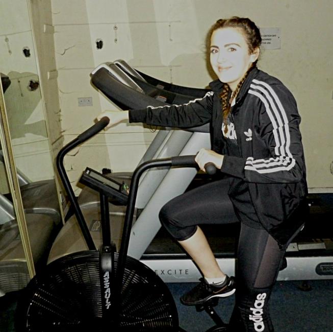 Nia works hard cycling