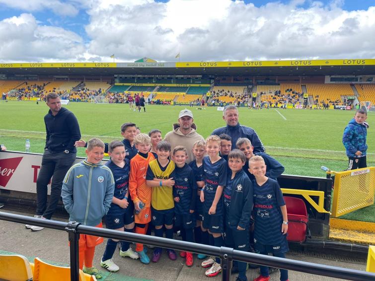 A photo shoot at pitch side at Carrow Road with former England star Jack Wilshere