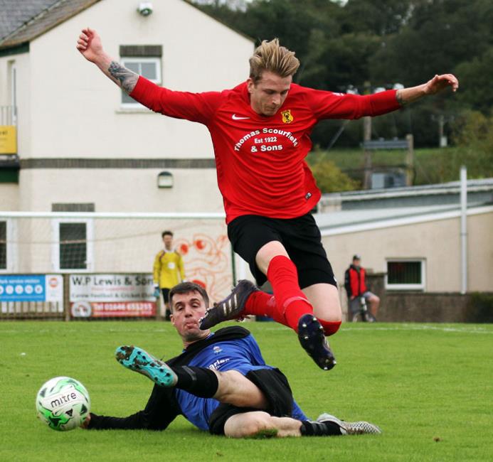 Athletic clear their lines as Ian  Darbyshire attempts to break for Carew.