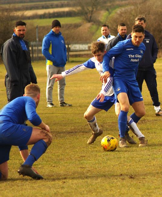 Matthew DIvry battles for possession for Bridge against Angle