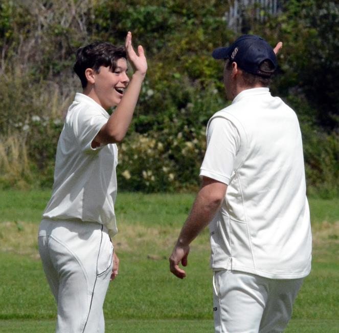 George Twigg celebrates wicket for Johnston