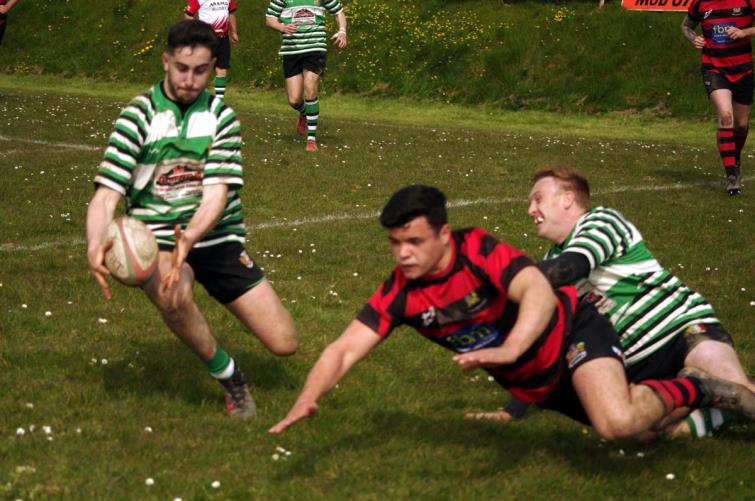 Whitland centre Gino Setaro pounces for a try