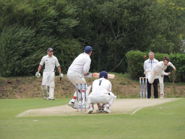 Matthew Davies tries in vain to shift Simon Holliday