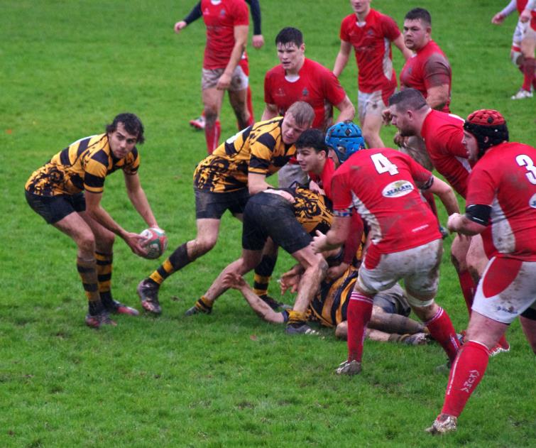 Rhys Mason gets his back line moving