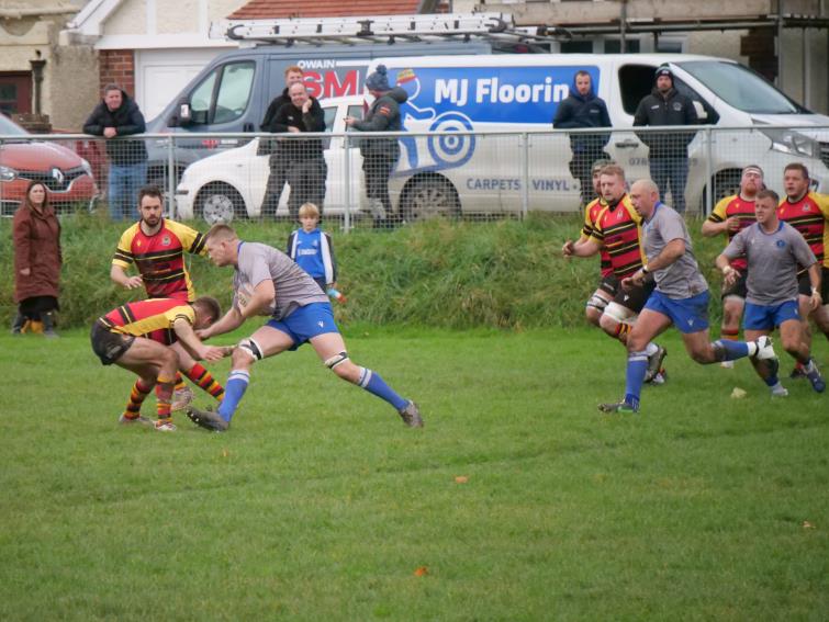 Jack Clancy on a late surge for The Blues. Picture by William John