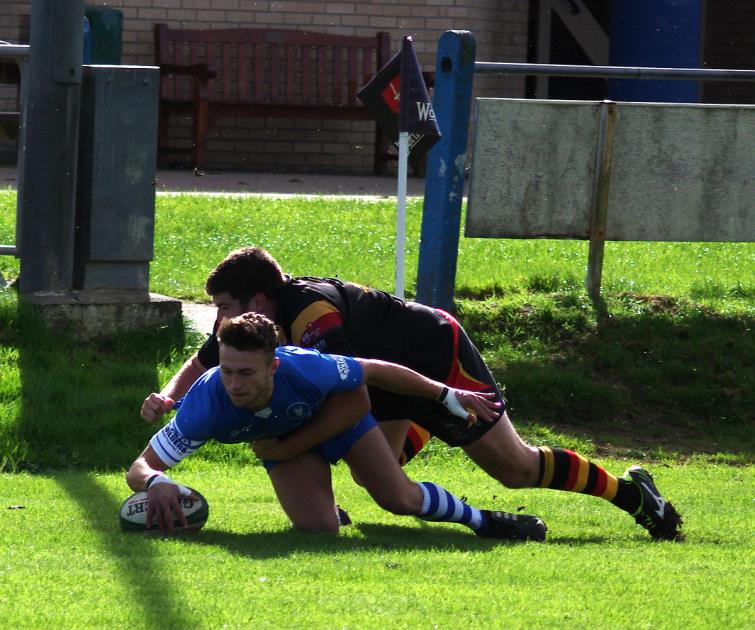 Josh Atherton dives over in the corner for Blues opening try