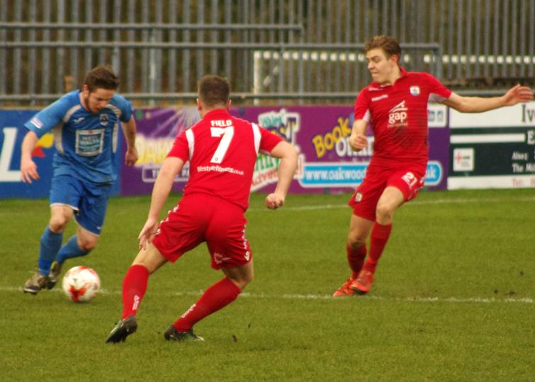 Steffan Williams takes on The Nomads defenders