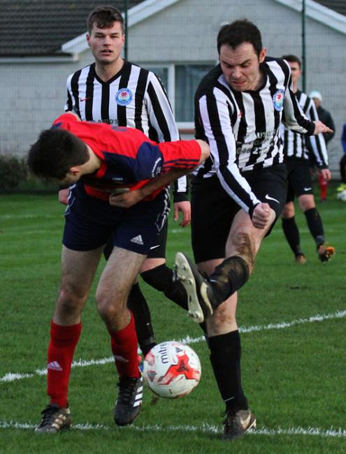 Neylands Sean Hannon clears the danger