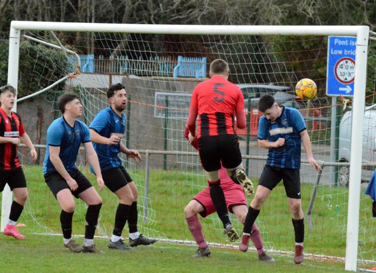 Scott Delaney headers home the opener for Goodwick United. Picture Gordon Thomas