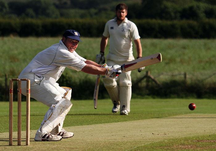 Simon Holliday steers a ball to the boundary