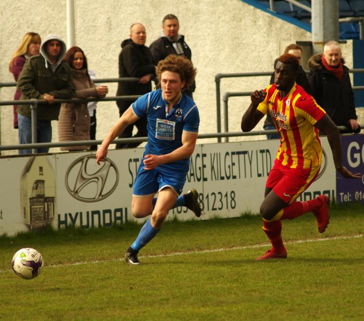 Greg Walters takes on Carlos Indjai at the Conygar Bridge Meadow