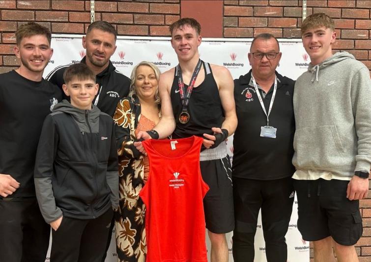 Alex and family with coach Graham Brockway
