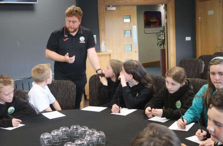 Harry imparting his knowledge to youngsters