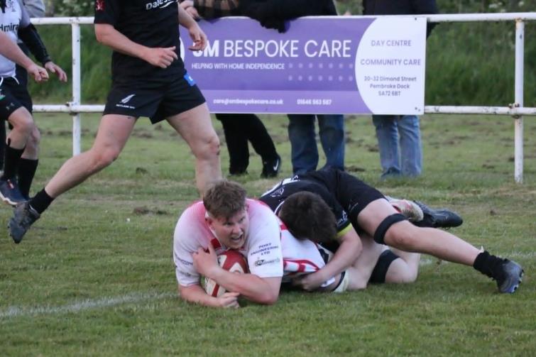 Man of the match Zac Davies crashes over for Milford. Picture Tim Phillips