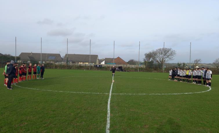 Neyland v Tenby pay respects. Picture Martin Jones