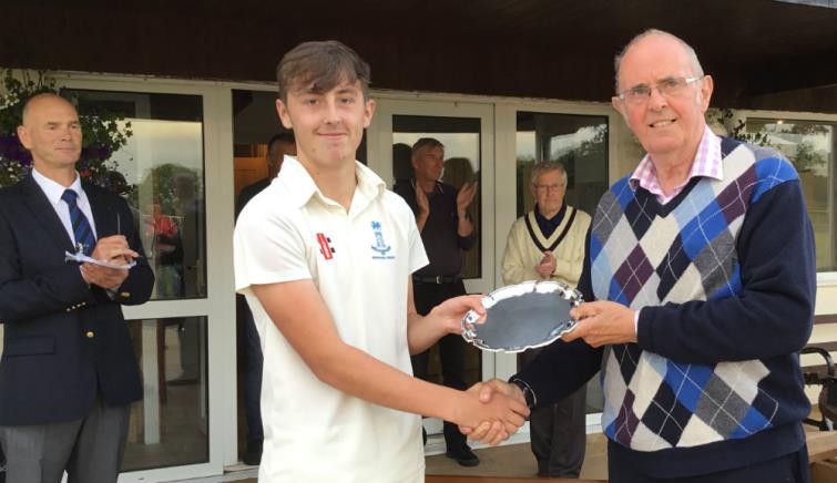 Skipper Noah Davies receives the Plate