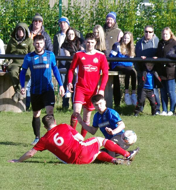 Camron Thomas puts in a bone crunching tackle