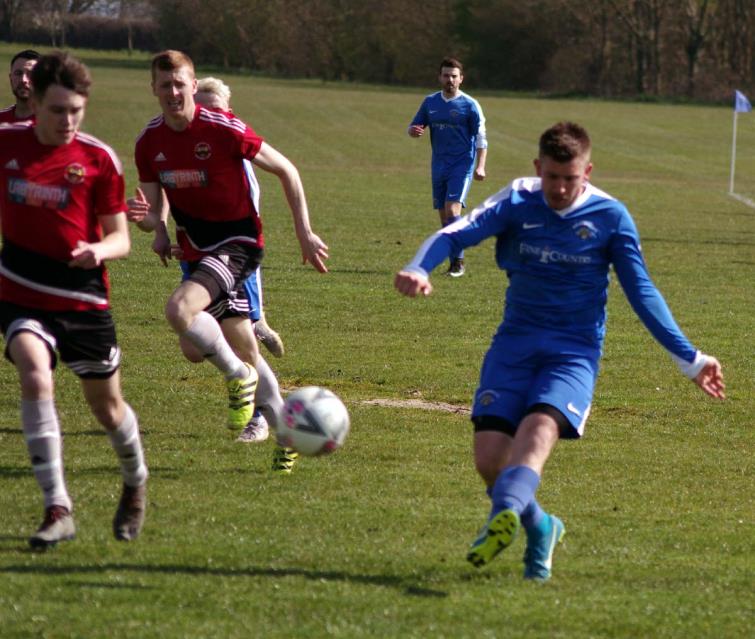 Luke Hayward puts in a cross for the Wizards against the Road