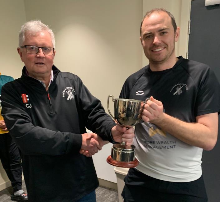 County Club vice-chairman Martin Jones presents the trophy to Sean Hannon