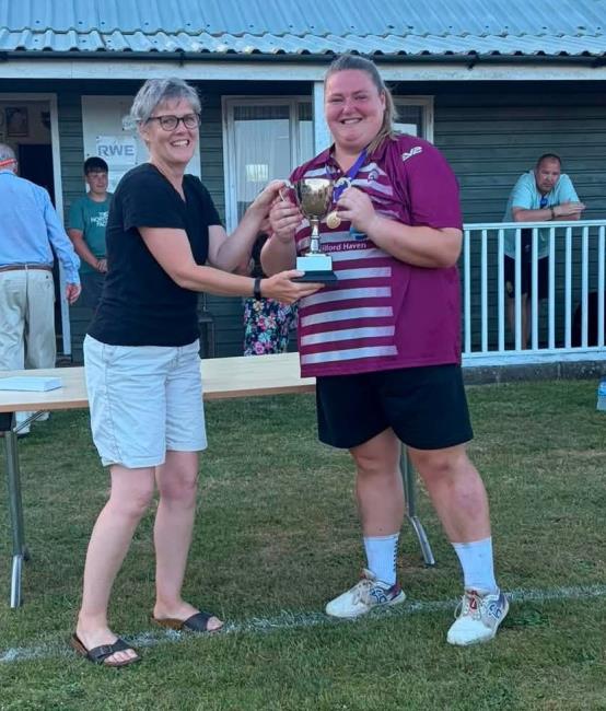 Cath Adams presents the trophy to Ffion Ashman