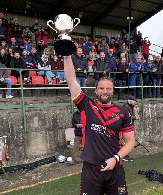 Seasiders skipper Alex Jenkins raises the KO Cup aloft