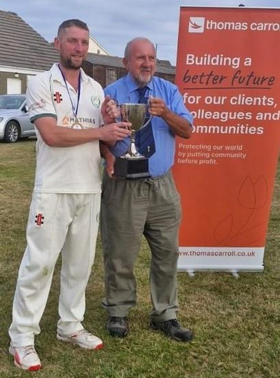  Tish skipper Jonathan Pawlett with the Division Two trophy