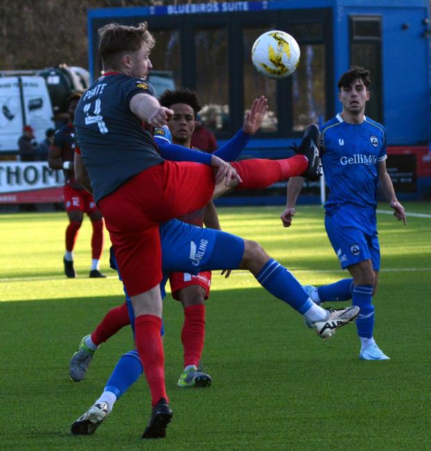 Nathan Peate clears the danger, the Bala Town skipper was sent off late on