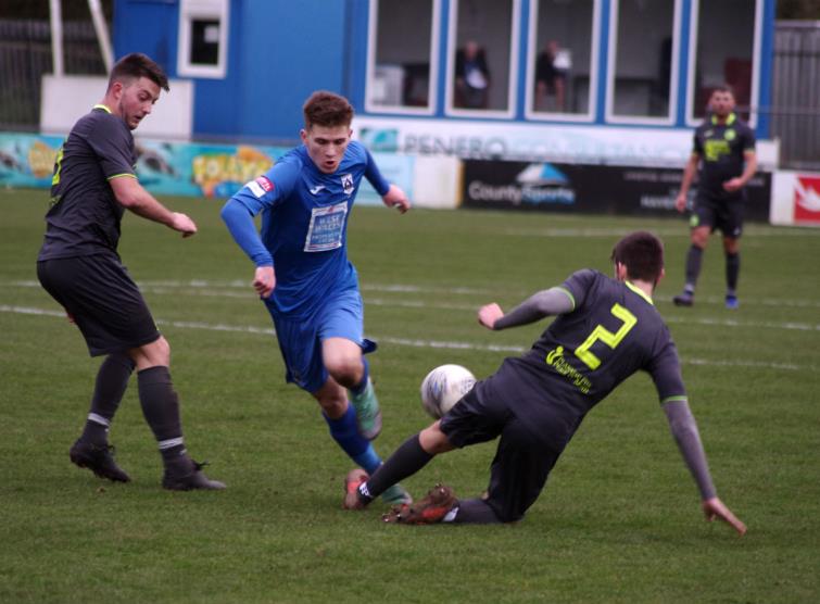 Cambrian and Clydach full back Joe Evans stops Danny Williams with a strong tackle