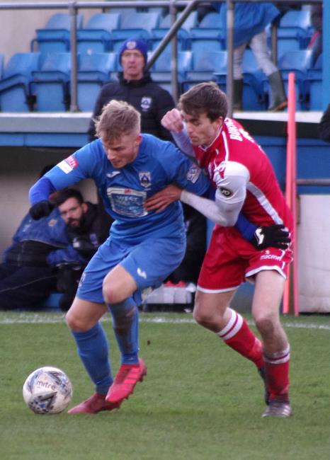 Tom Dyson works hard to keep possession