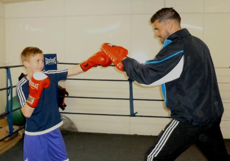 Kyle doing pad work with dad Wayne
