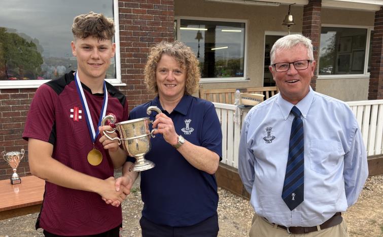 Cresselly skipper Josh Lewis with Sam Rossiter and chairman Martin Jones from the County
