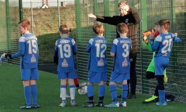 Harry with eager young players