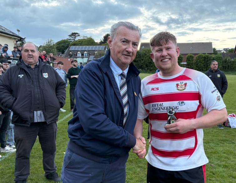 Match sponsor Huw Hughes with man of the match Zac Davies