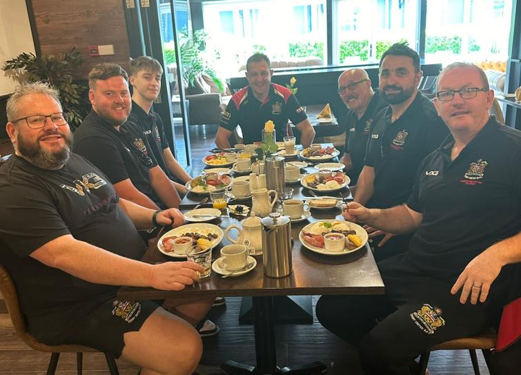 Tenby coaches with their hearty-healthy breakfast