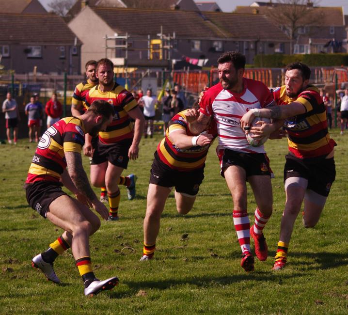 ​Mariners Craig Barnett is held by Cardigan defence