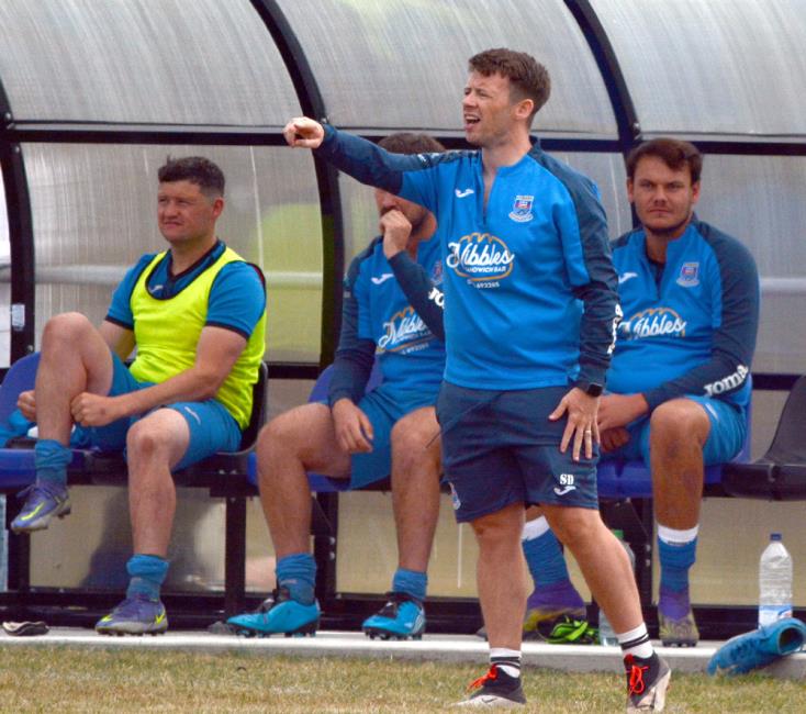 Hakin manager Scott Davies was proud of his players performance despite suffering cup defeat in north Wales